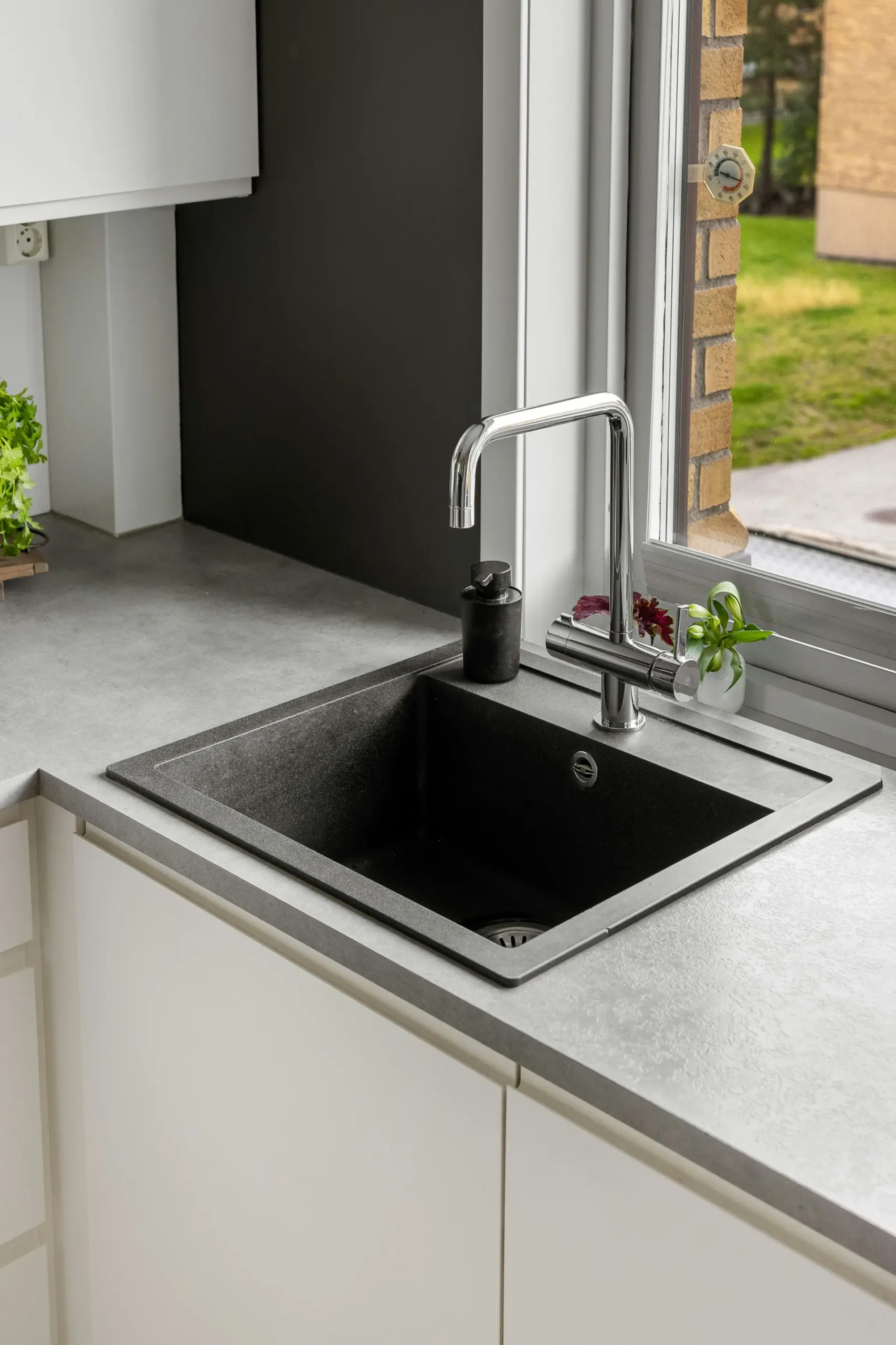 Modern kitchen sink with faucet.